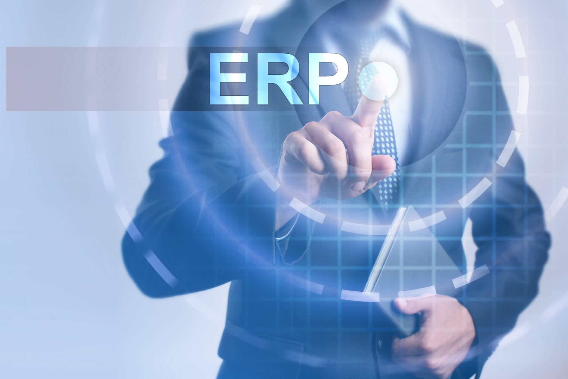 Man in suit clicking on a clear screen with ERP letters