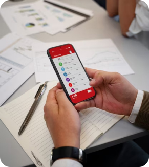 a man holding mobile device with banking software