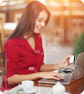 A young woman holding credit card laptop